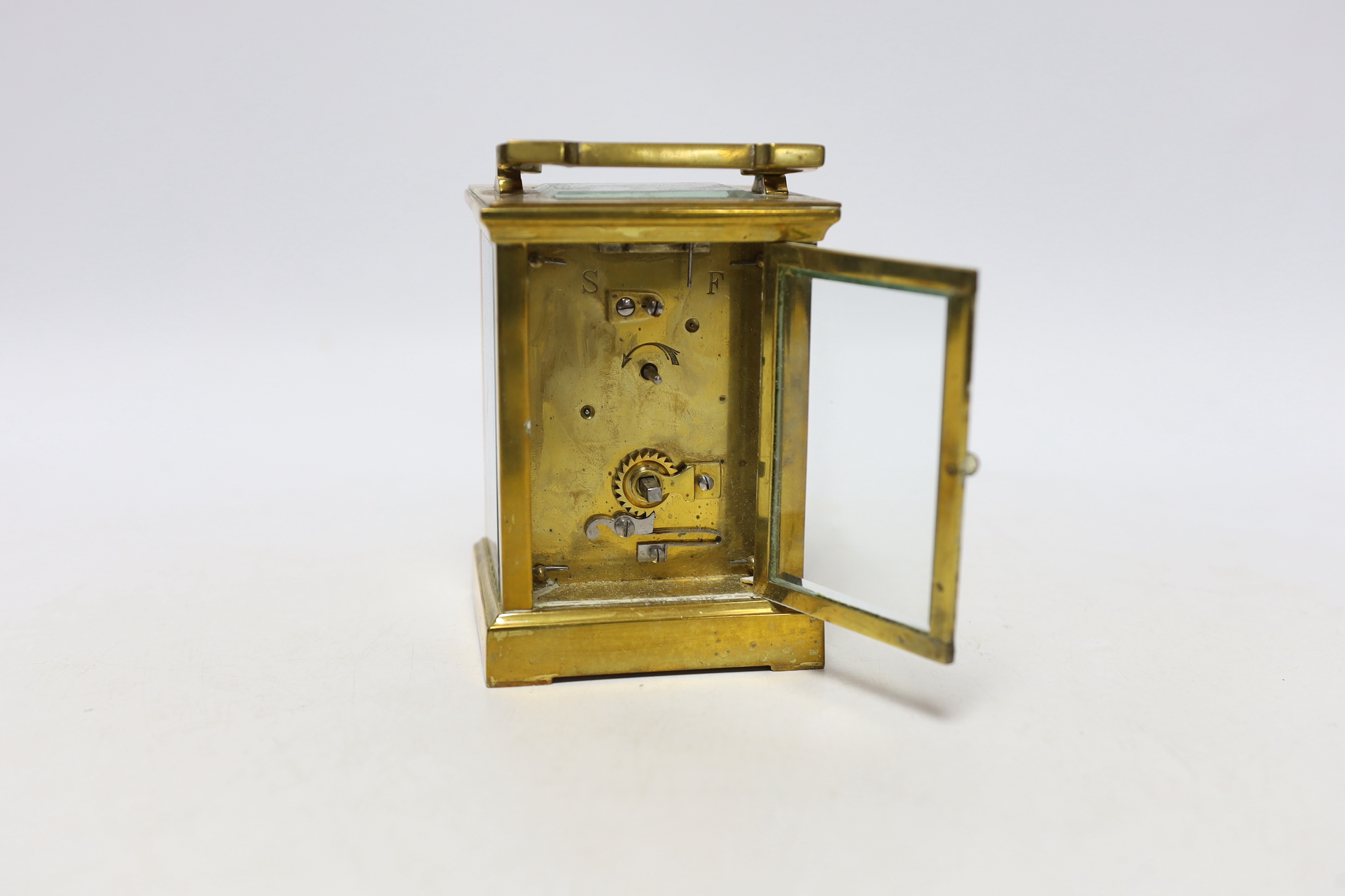 A cased brass carriage timepiece, 14cm high